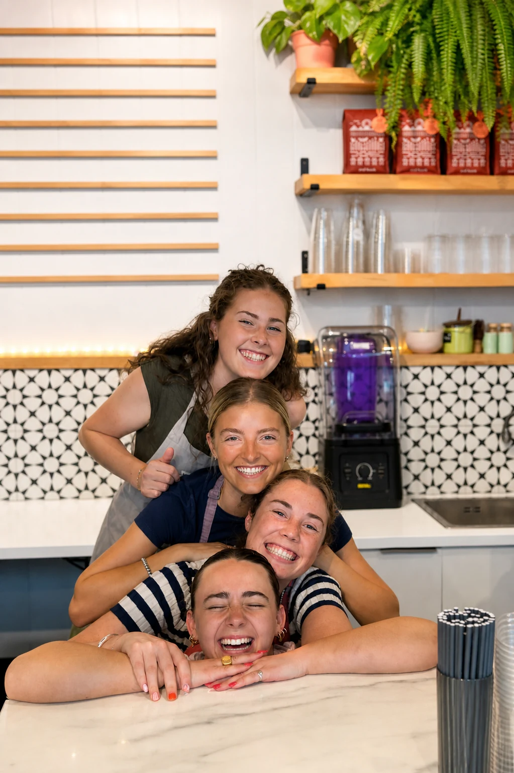 The Yonder team smiling together behind the counter